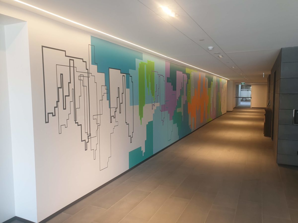 Cityscape mural brightens up office passageway